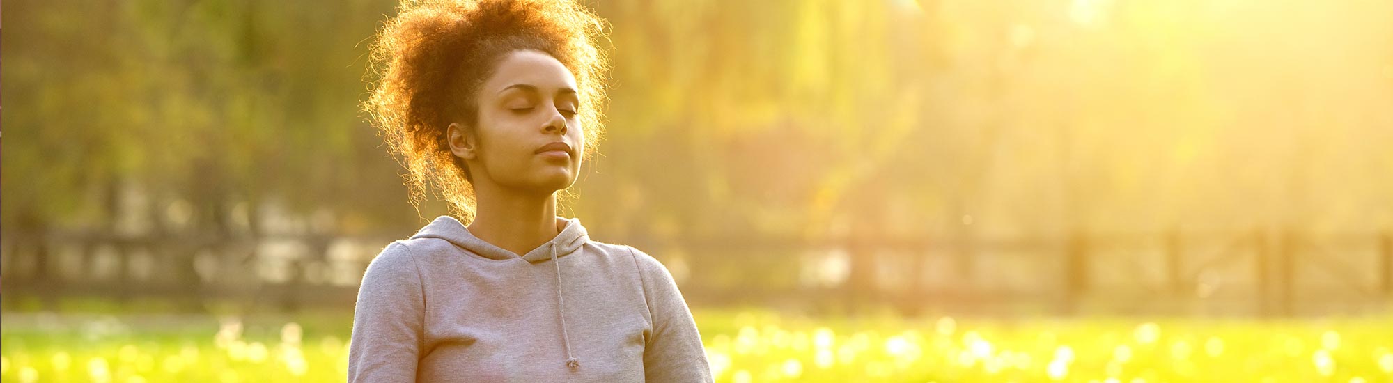 Woman Sitting in Field